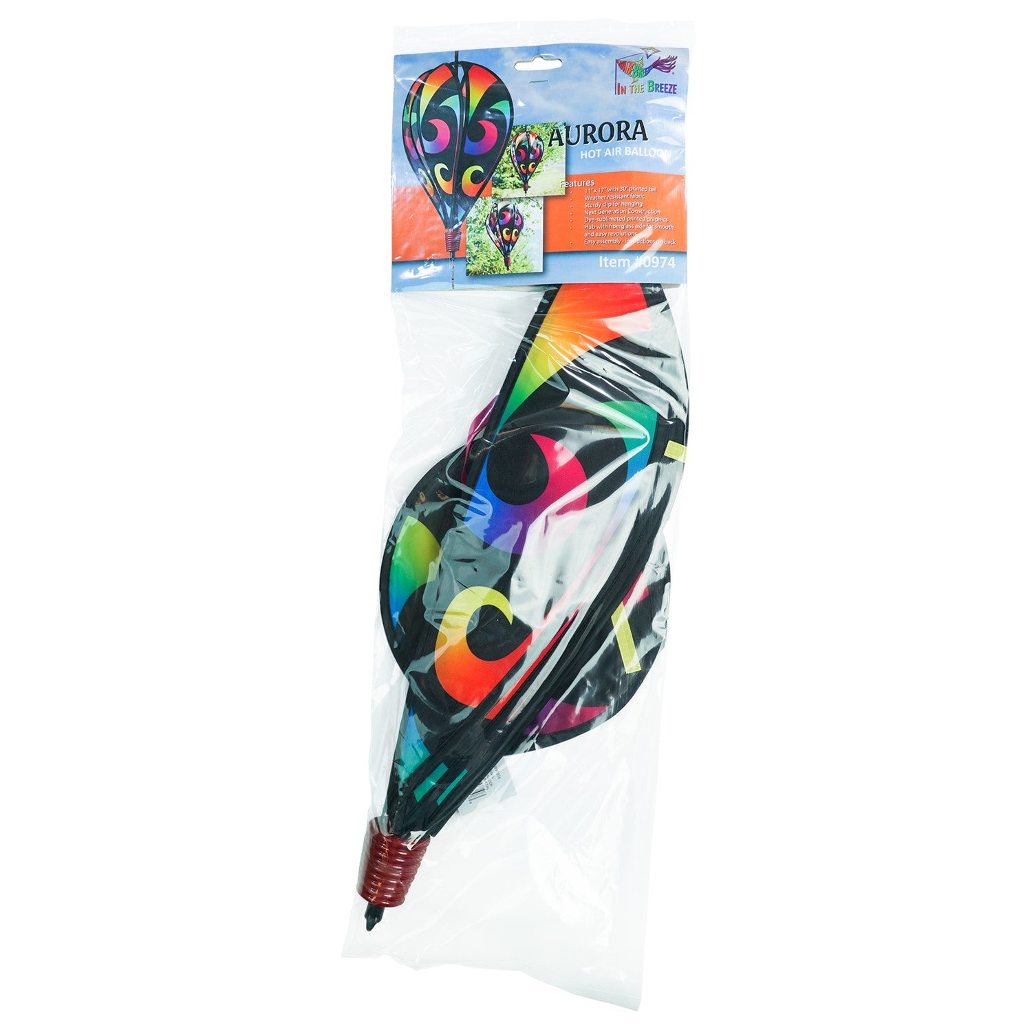 Aurora 6-Panel Hot Air Balloon in vibrant rainbow colors, displayed in a garden setting, spinning gracefully with colorful tail.