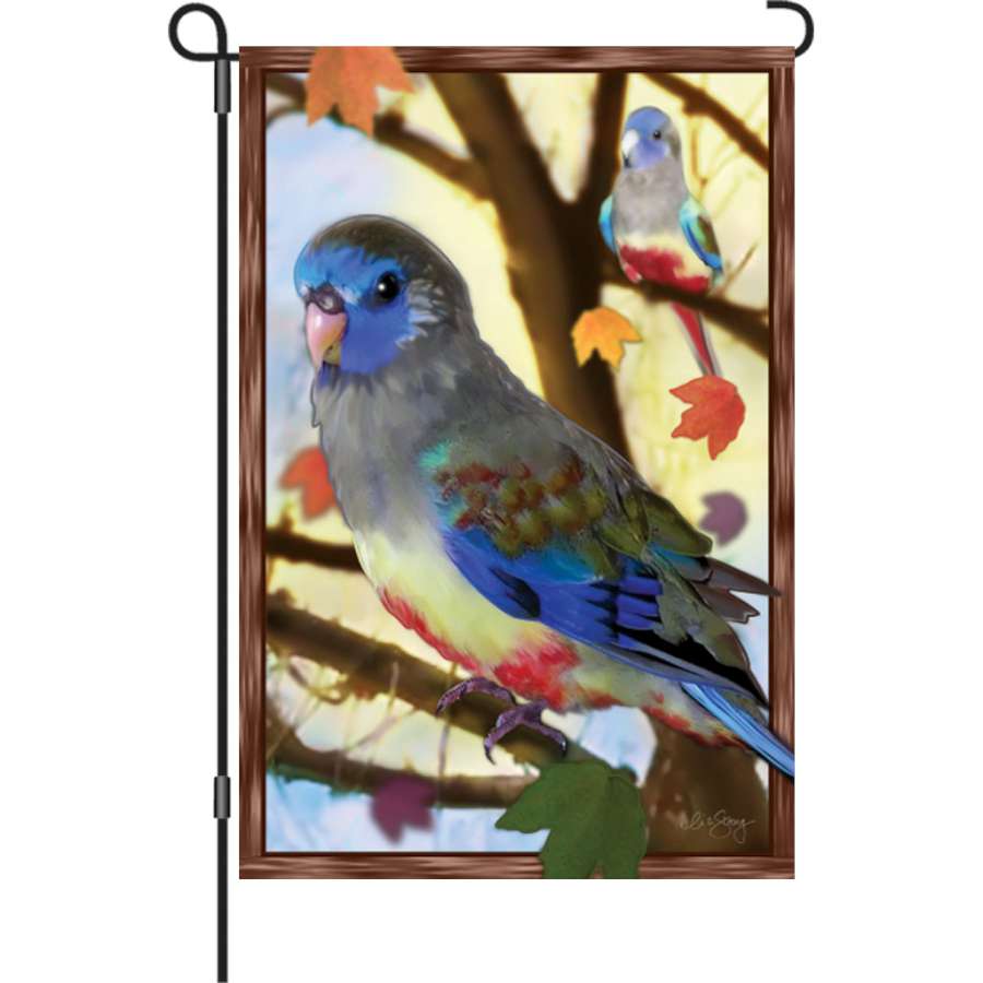 12-inch Autumn Blue Bonnets garden flag displayed outdoors showcasing vibrant blue bonnets and autumn colors in a garden setting.