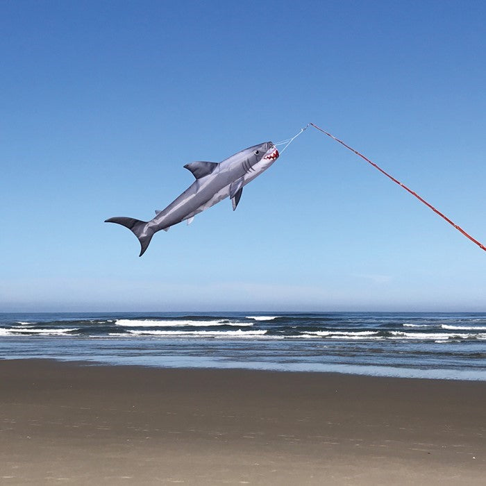 30-inch Baby Shark Fish Windsock hanging outdoors, showcasing its colorful design in a breezy setting, perfect for marine-themed decoration.