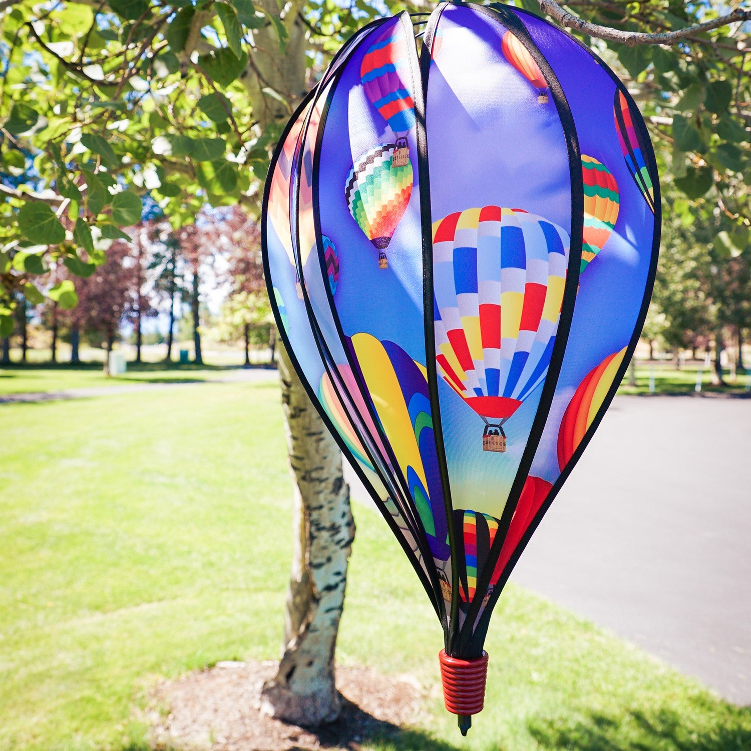 The Balloon Fest 10-Panel Hot Air Balloon Spinner features a bright and colorful design of hot air balloons spinning in the breeze, adding whimsy to your garden decor.