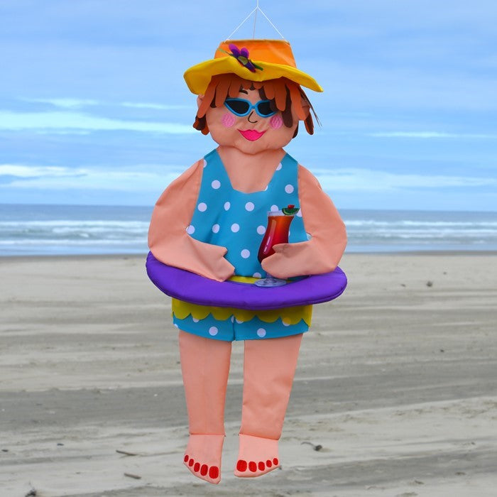 Beach Bev Wind Friend hanging decor featuring 3D design, vibrant colors, and embroidered accents, displayed outdoors in a garden setting.
