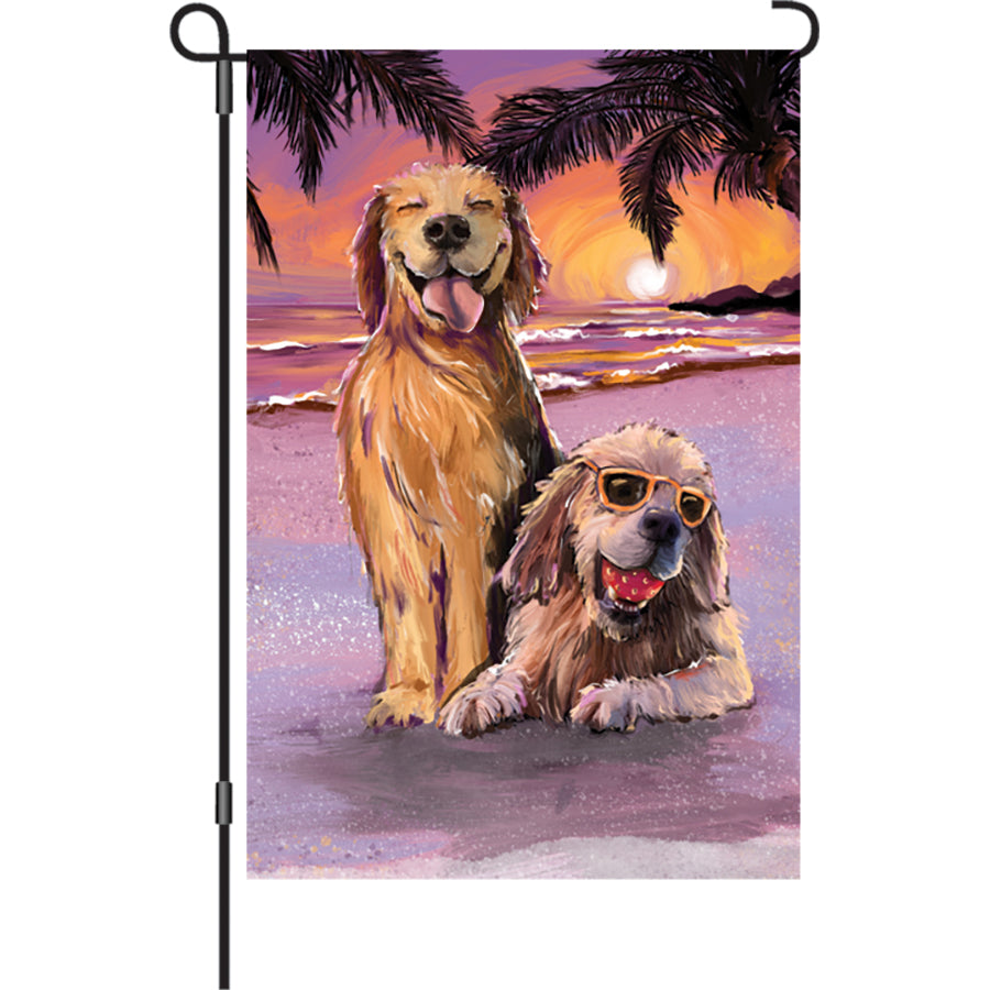 12 in. Beach Dogs garden flag with colorful designs of playful dogs celebrating summer displayed on a garden stand.
