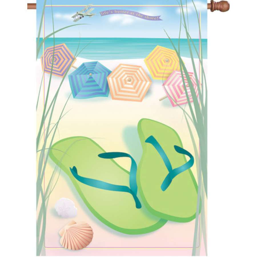 28-inch 'Better at Shore' house flag featuring vibrant beach-themed design displayed in a sunny outdoor setting.