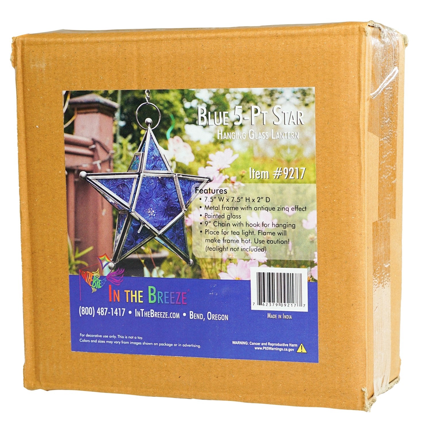Blue 5-Point Star Hanging Tealight Lantern with textured glass panels and metal frame, suspended elegantly with a chain in an outdoor setting.