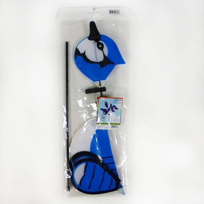 Blue Jay Baby Spinner vividly displayed in a garden setting, featuring colorful design and 12-inch spinning wheel for outdoor charm.