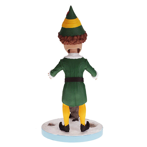 Buddy the Elf with Raccoon bobblehead standing on a shelf, showcasing vibrant colors and playful design, perfect for holiday decor.
