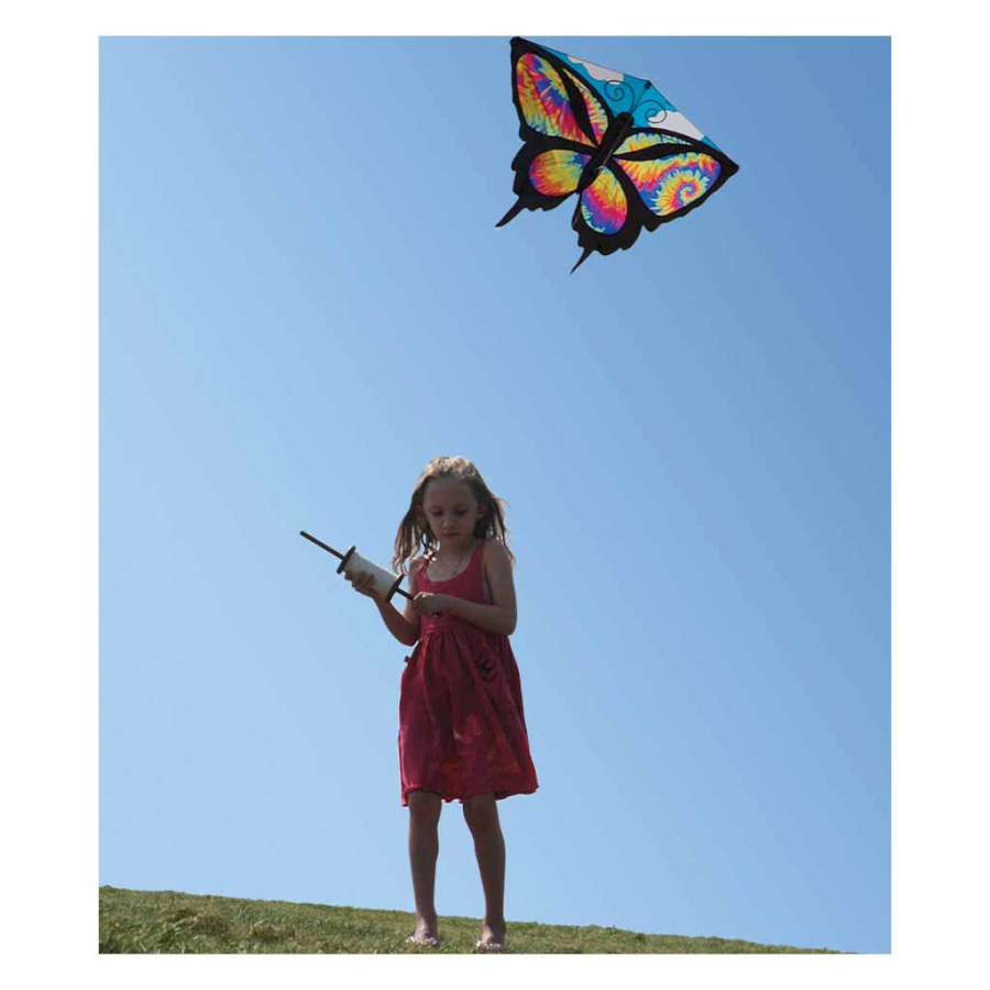 Colorful Butterfly Kite - Tie Dye, measuring 52 x 37 inches, soaring high against a blue sky, showcasing its vibrant design and details.