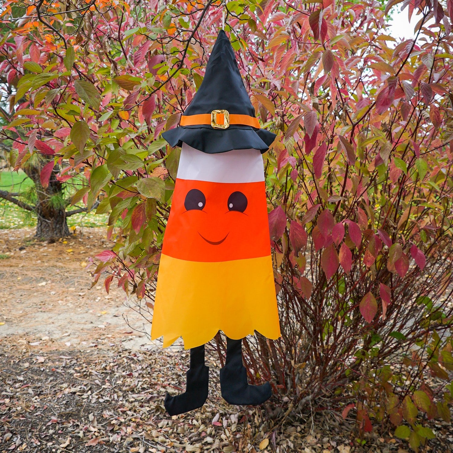 Candy Corn 3D Cone Windsock featuring bright colors and whimsical design, hanging outdoors for Halloween decoration.