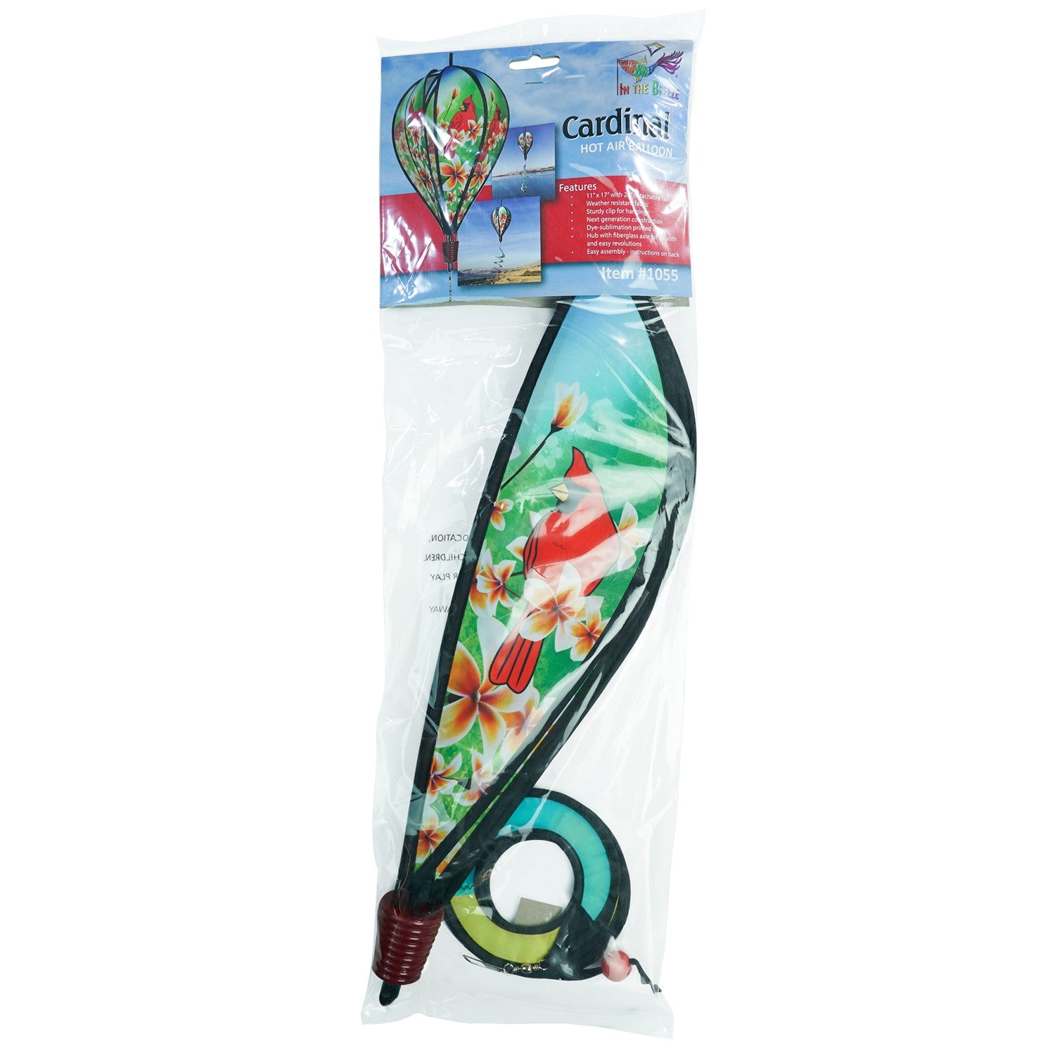 Vibrant Cardinal Hot Air Balloon spinner with cardinal and plumeria design, spinning gracefully in a garden setting to showcase its colorful features.