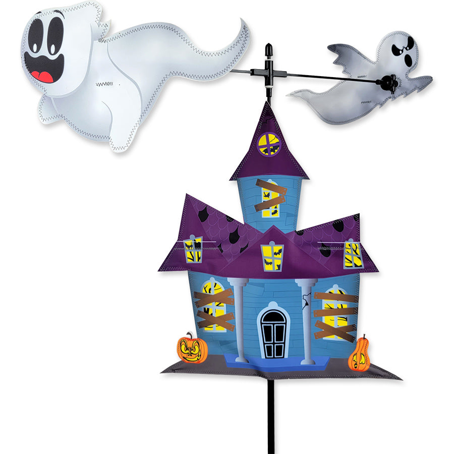 Carousel Spinner featuring two ghosts spinning around a haunted house, showcased in an outdoor garden setting.