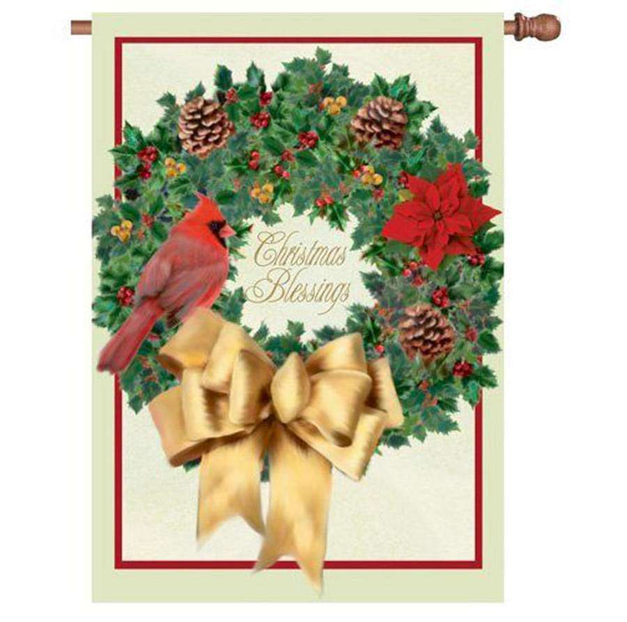 28 in. Christmas Blessings house flag displaying vibrant holiday imagery in a snowy outdoor garden setting, enhancing seasonal decor.