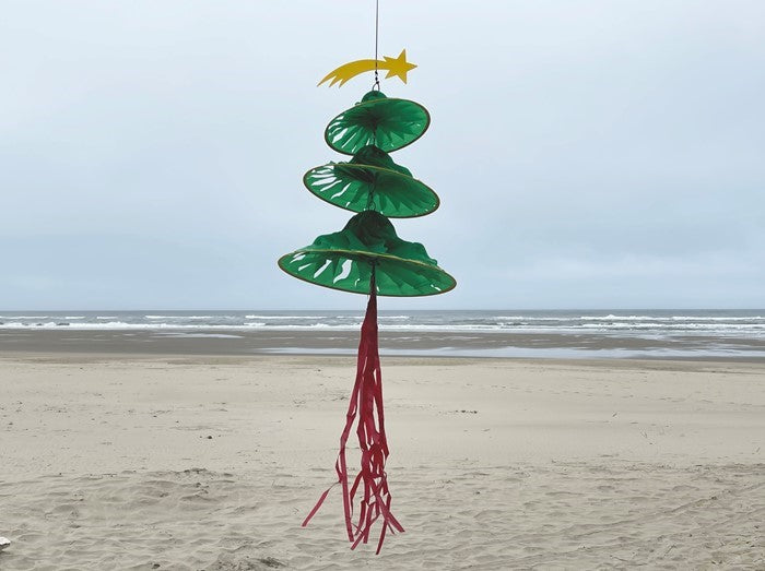 Christmas Tree Triple Jelly wind decoration displaying three spinning sections in festive colors, hanging outdoors with flowing tails.