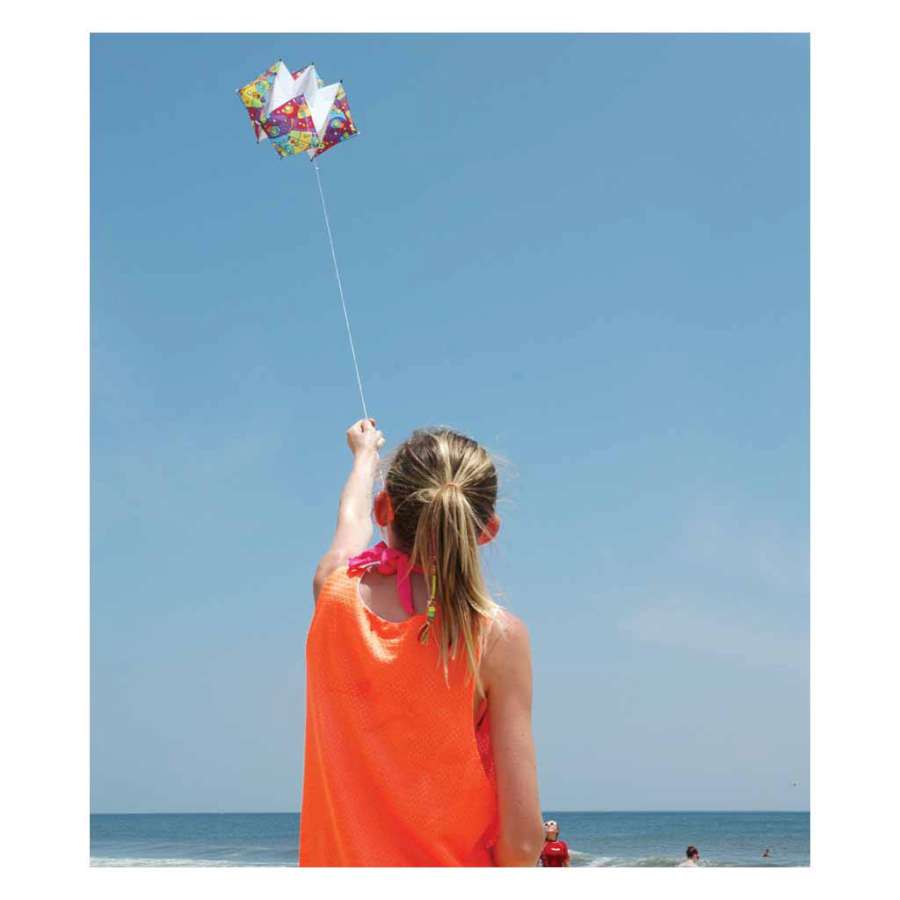 Clarke's Crystal Box Kite - Rainbow Orbit soaring in the sky with vibrant colors, measuring 53 inches in diameter, perfect for outdoor fun.