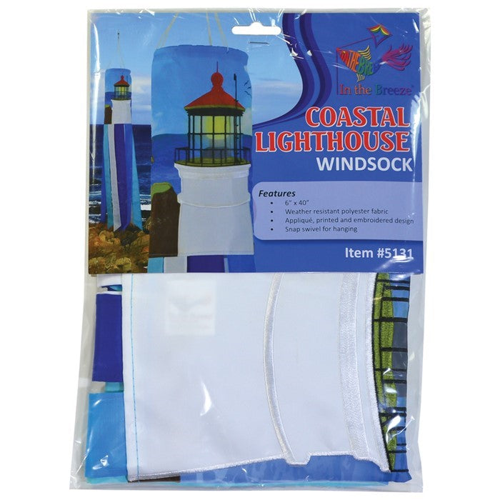 Coastal Lighthouse 40-inch windsock with vibrant lighthouse design and tails hanging elegantly from a garden in a coastal setting.