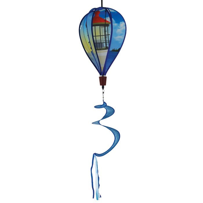 Coastal Lighthouse 6-Panel Hot Air Balloon spinner in vibrant colors with a lighthouse design hanging in a garden setting, spinning in the breeze.