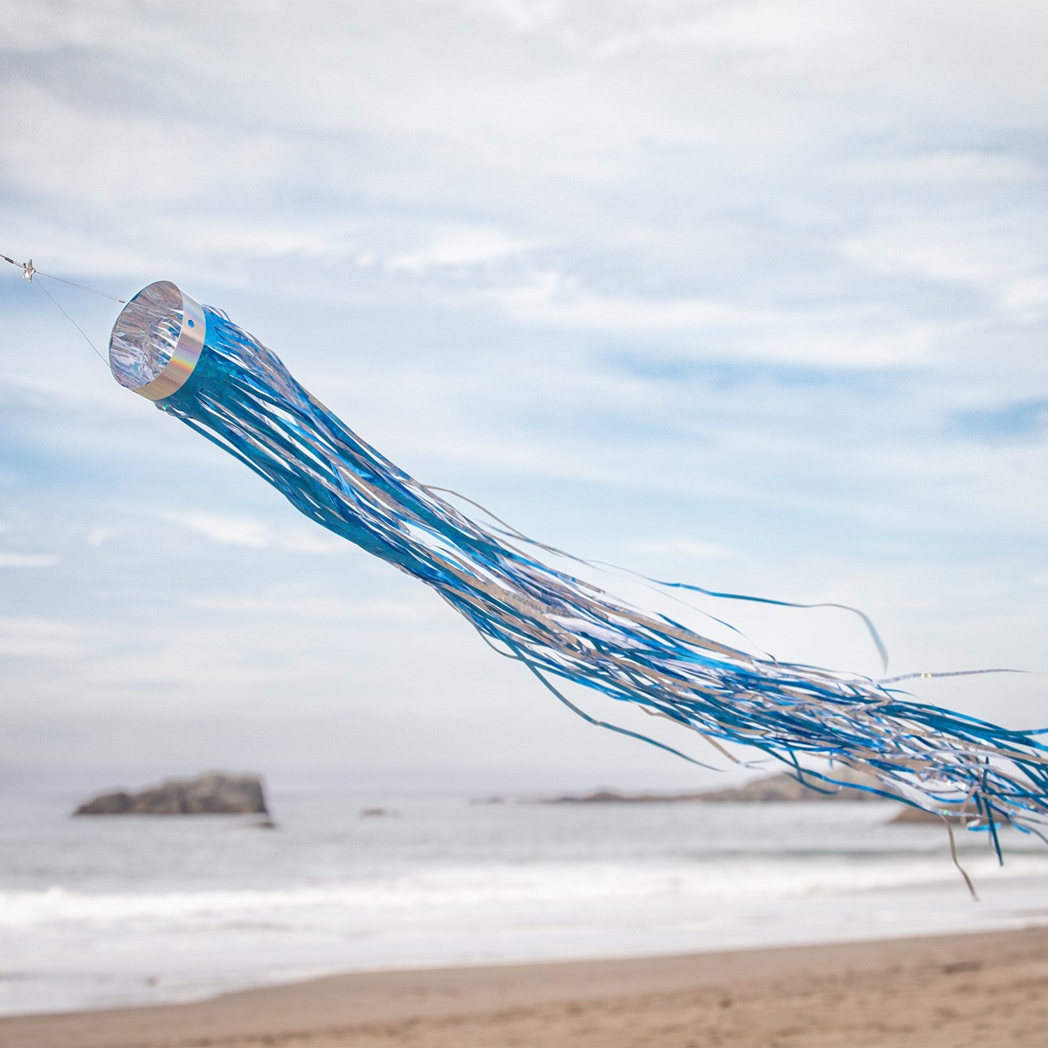 Cobalt 51' Mylar Windsock fluttering gracefully in the breeze, showcasing a vibrant holographic blue design that shines in sunlight.