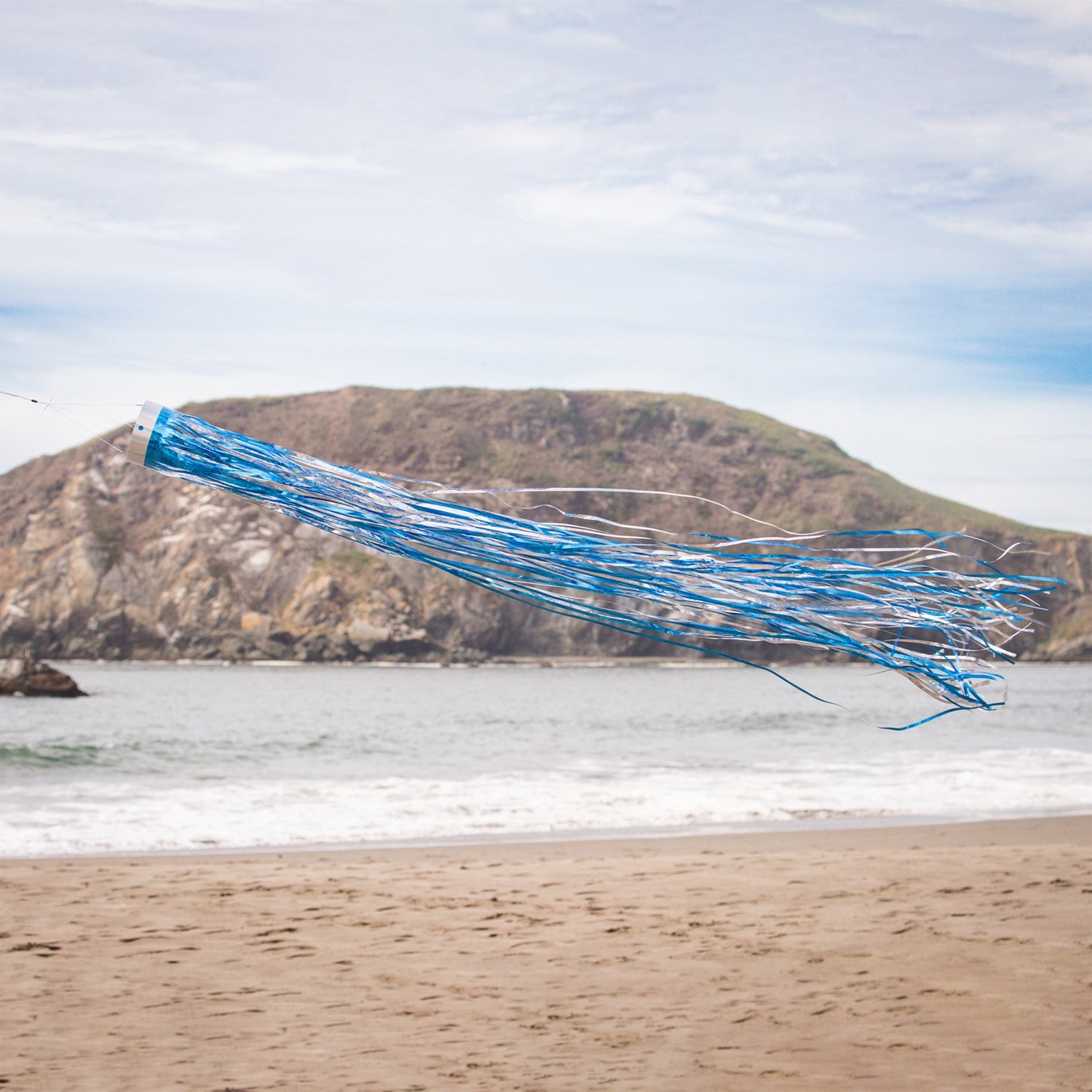 Cobalt 51' Mylar Windsock fluttering gracefully in the breeze, showcasing a vibrant holographic blue design that shines in sunlight.