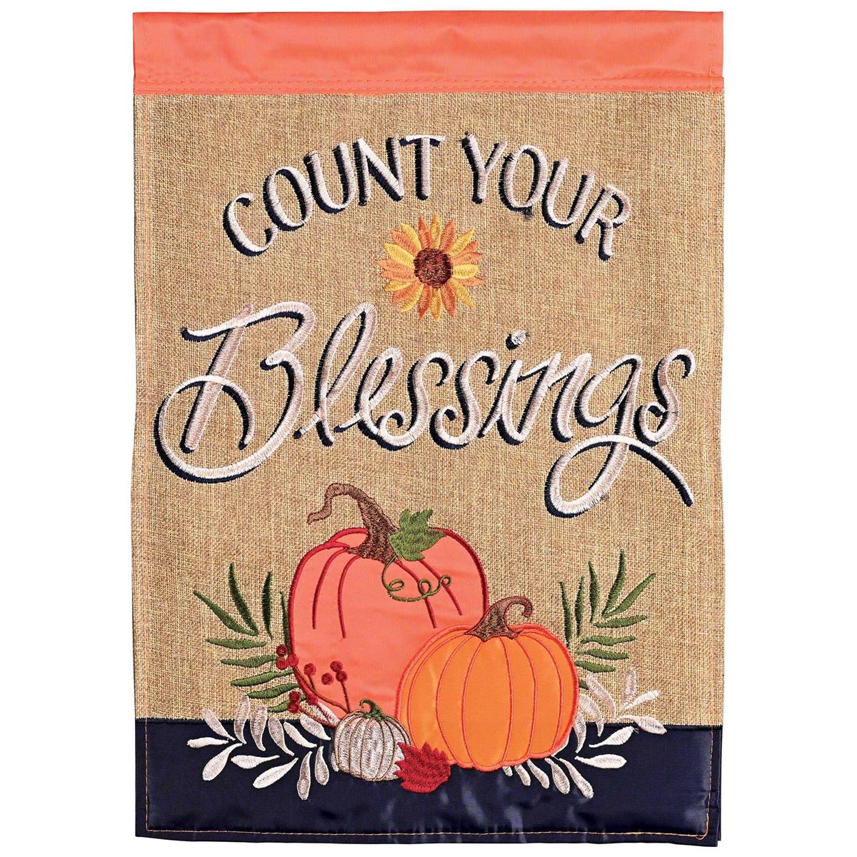 Count Your Blessings double-sided garden flag featuring detailed fabric appliques and embroidery displayed outdoors in a garden setting.