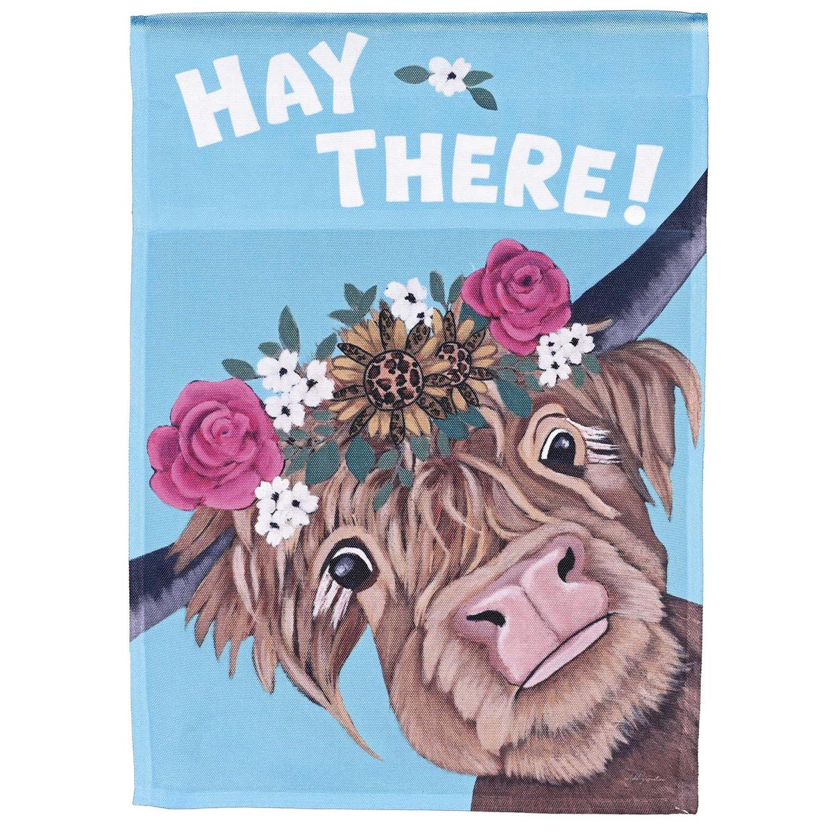 Cow Hay There garden flag with a whimsical design displayed in an outdoor setting, made of durable heavy-duty polyester, measuring 13x18 inches.