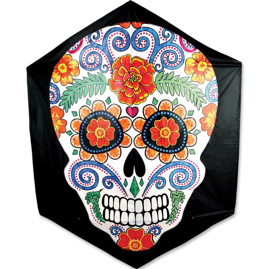 Rokkaku kite featuring a bright sugar skull, wrapped carbon frame, and ripstop polyester for smooth and stable flying in moderate wind.