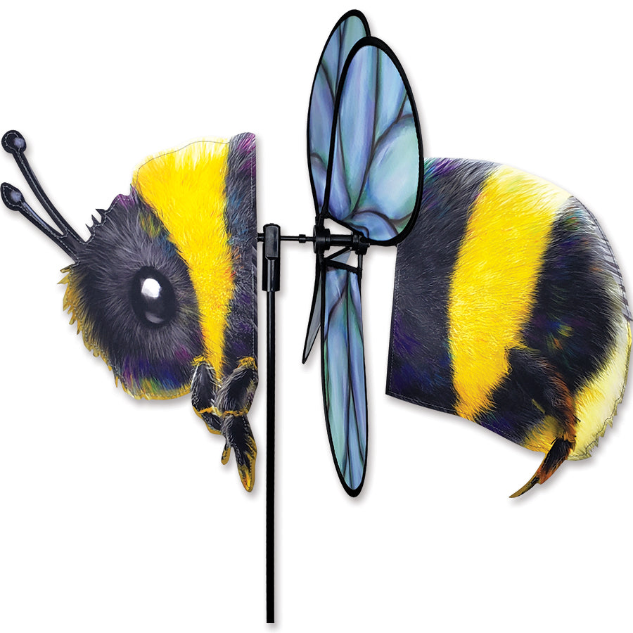 Deluxe Petite Spinner - Bee in a vibrant design, elegantly spinning in a garden setting on a sunny day, showcasing its beauty and motion.