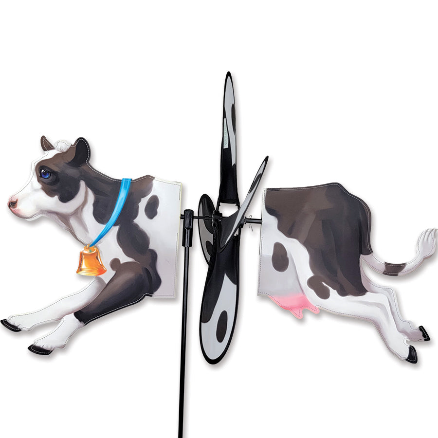 Deluxe Petite Spinner in striking black and white cow design, perfect for lawn or garden decoration, effortlessly spins in a light breeze and adds charm to outdoor spaces.
