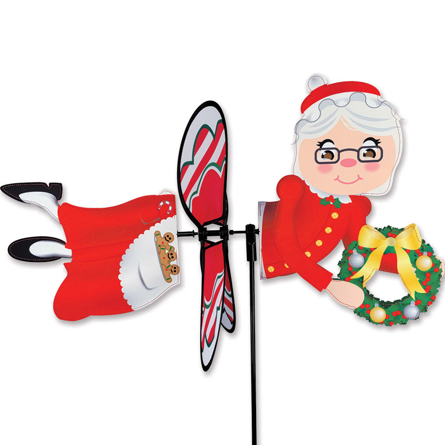 Deluxe Petite Spinner - Mrs. Claus featuring a cheerful design, spinning in a gentle breeze at a festive outdoor display.