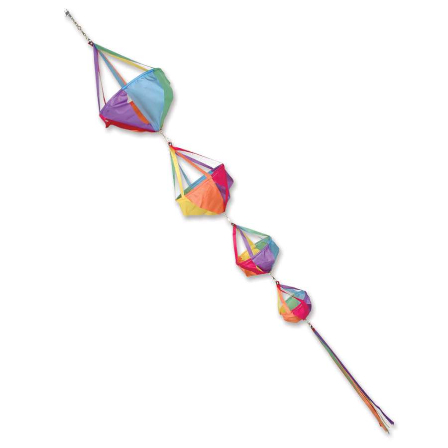 Deluxe Spinnie Set - Circus featuring colorful wind spinners with matching streamer tails installed in a vibrant outdoor setting.