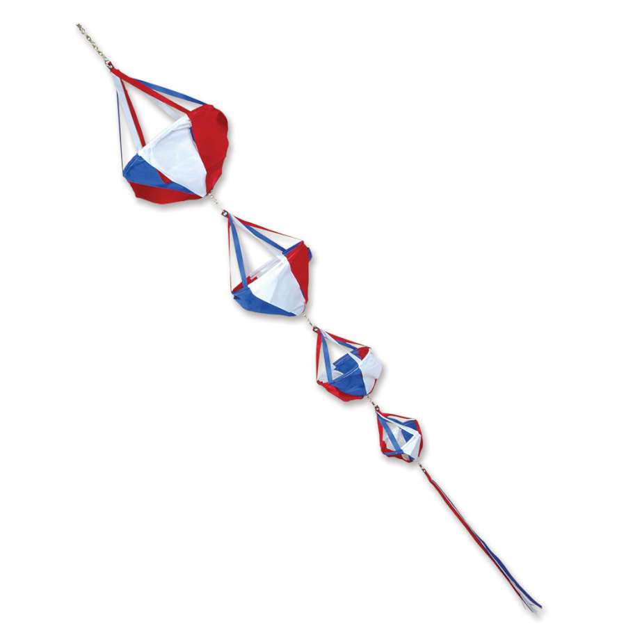 Deluxe Spinnie Set with colorful patriotic designs and matching streamer tails spinning on poles in a lively outdoor setting.