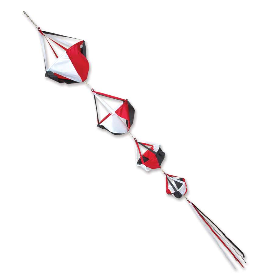 Deluxe Spinnie Set - Tecmo featuring colorful spinning decorations with streamer tails displayed in a garden setting on a bright day.