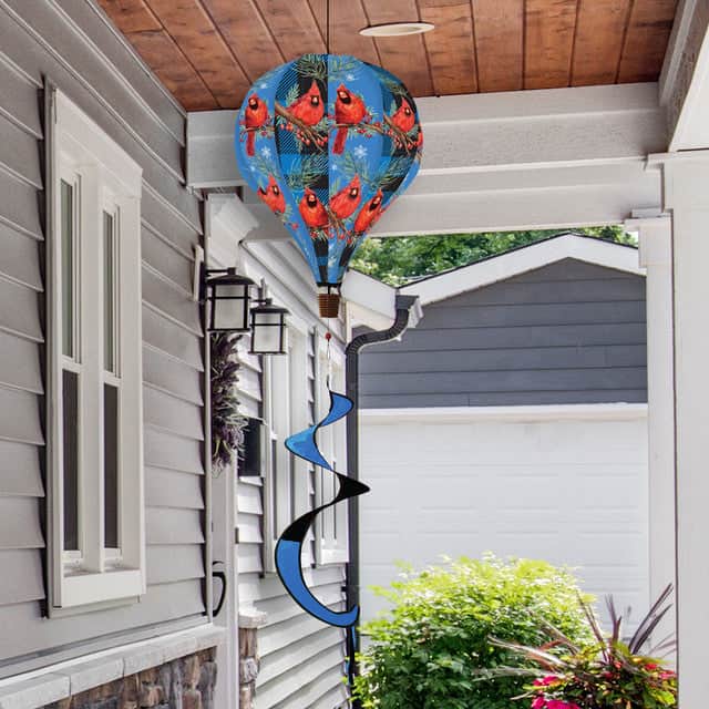 Cardinal-themed hot air balloon spinner with vibrant red birds, durable polyester, and flowing tail for serene and stylish outdoor seasonal decorating.