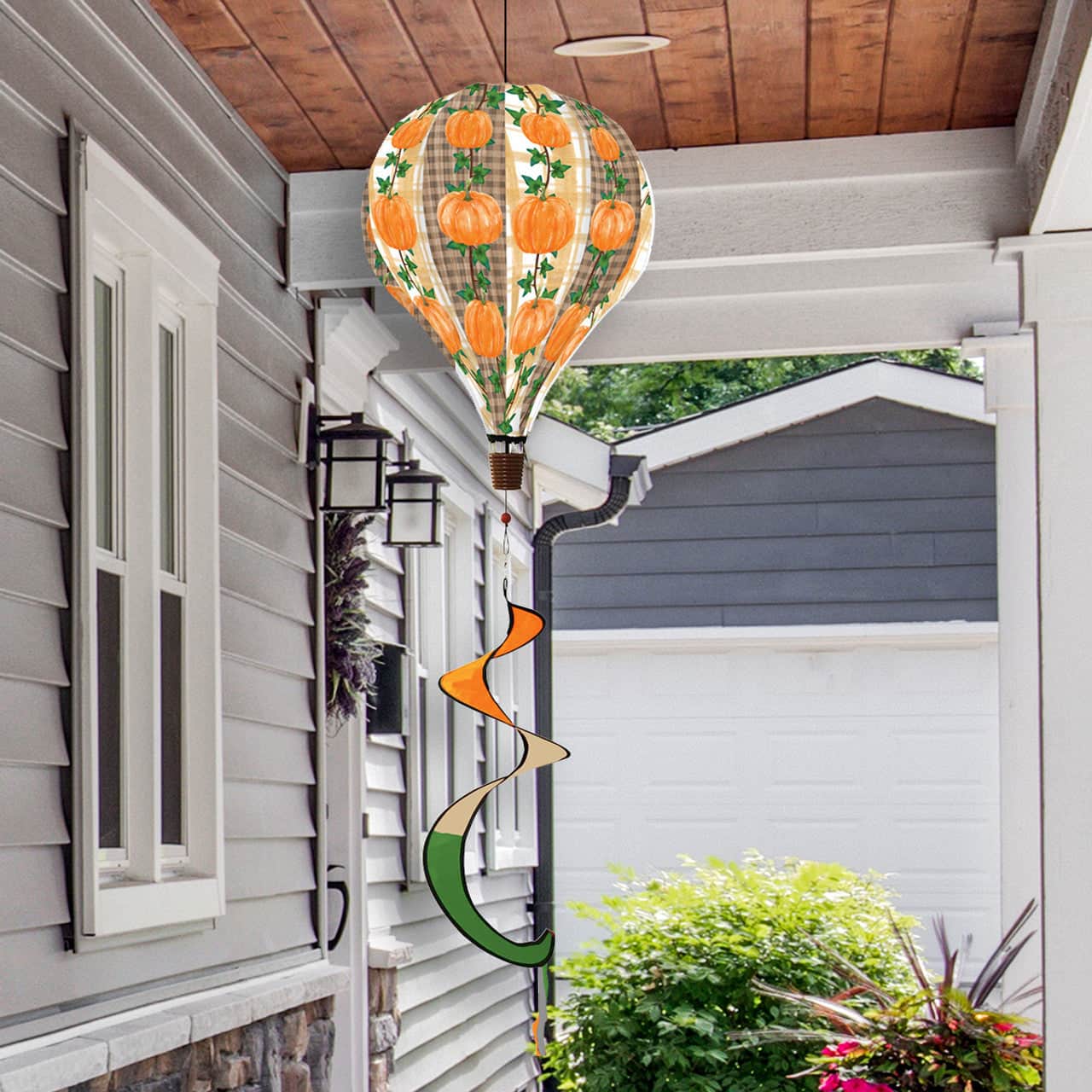 Rustic pumpkin hot air balloon spinner with burlap-look polyester and fall-inspired design, perfect for outdoor seasonal motion and autumn garden décor.