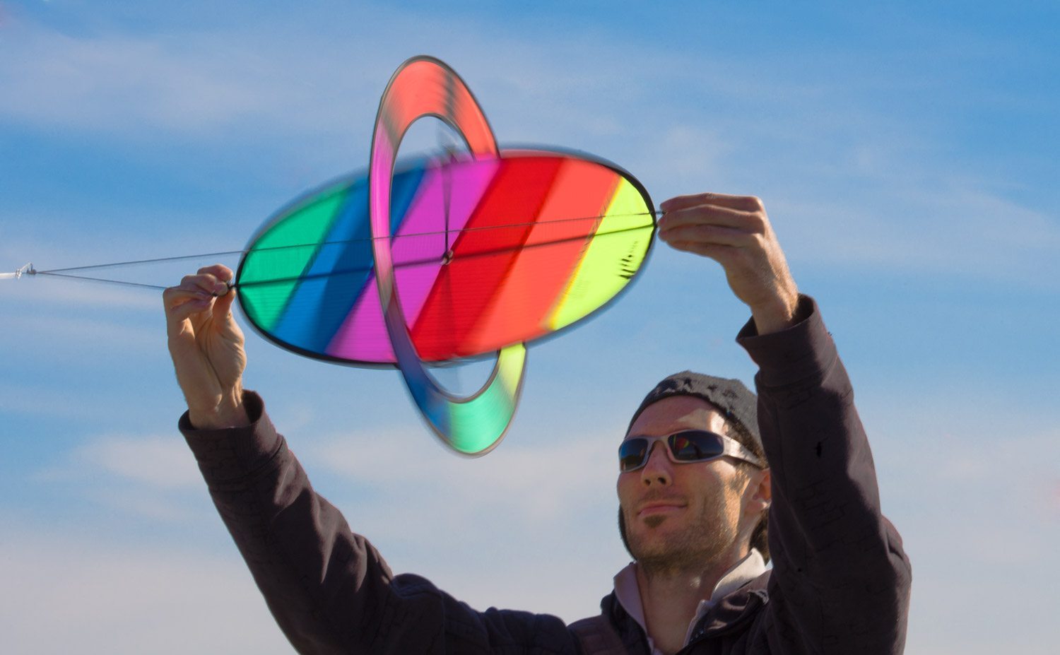 Rotor-style kite with spinning wing creates a colorful, gyroscopic flight display powered by the Magnus Effect.