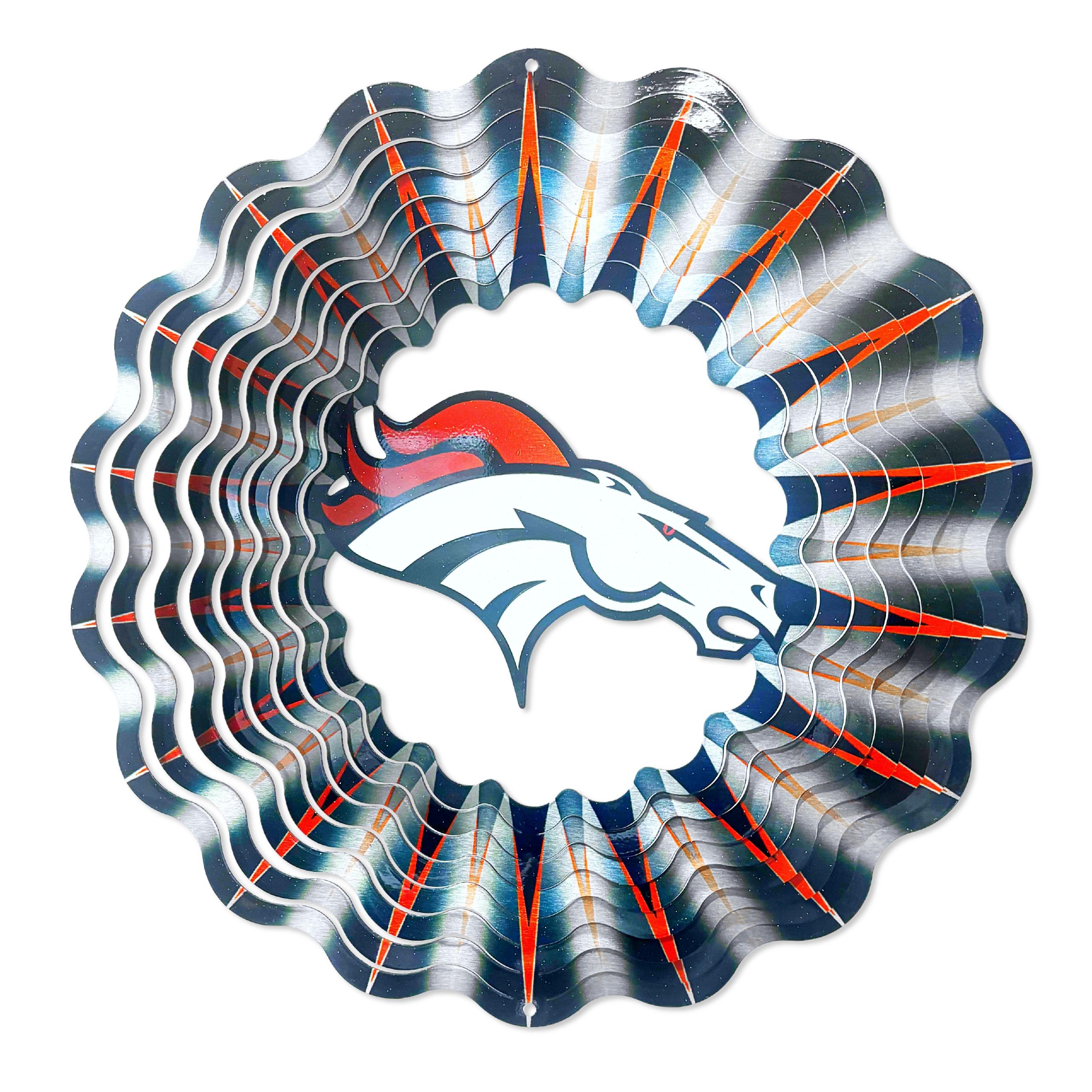Denver Broncos NFL Wind Spinner showcasing team colors and graphics, spinning gracefully in an outdoor garden setting.
