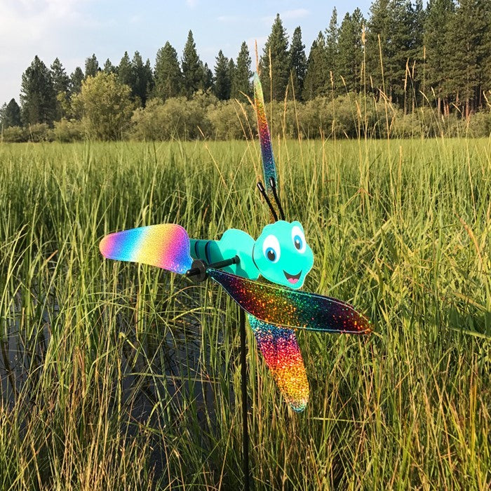Colorful Dragonfly Baby Whirligig garden decoration with reflective mylar wings, spinning in the breeze, designed to add charm to outdoor spaces.
