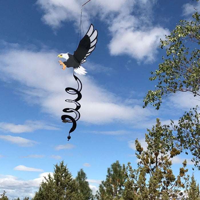 Eagle Theme Twister with moving wings and curlie tail, beautifully displayed outdoors, showcasing its vibrant colors and 3D design.