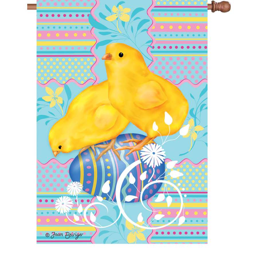 28 in. Easter Chicks Flag featuring fluffy chicks and colorful eggs, displayed on a house flagpole in a vibrant outdoor setting.
