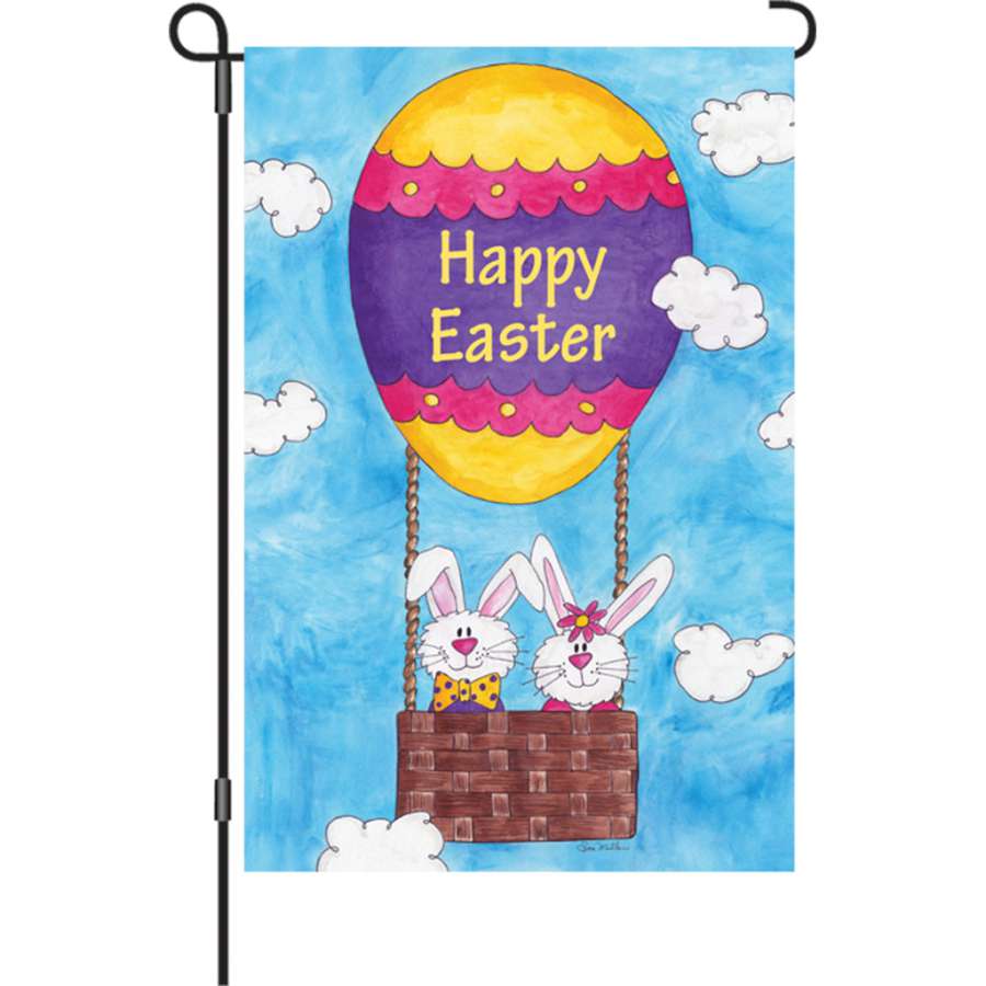 12 in. garden flag with 'Easter Is in the Air' design in vibrant pastels, displayed outdoors on a flag stand, perfect for spring decoration.