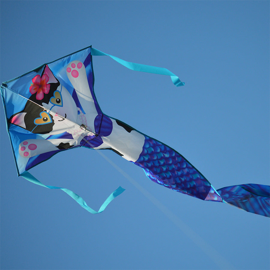 The Easy Flyer Kite - Purrmaid features vibrant colors and appliques, measuring 30 x 90 inches, soaring high against a clear sky.