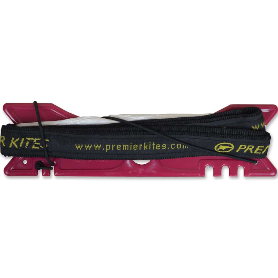 Extracto 200 lb. Spectra Kite Line with molded winder tool, ready for aerial maneuvers showing its high-strength construct in outdoor kite setup.