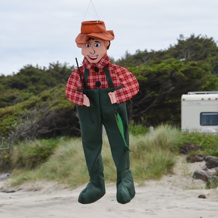 Fisher Fred Wind Friend staged outdoors, adding a playful fishing theme to a garden or yard.