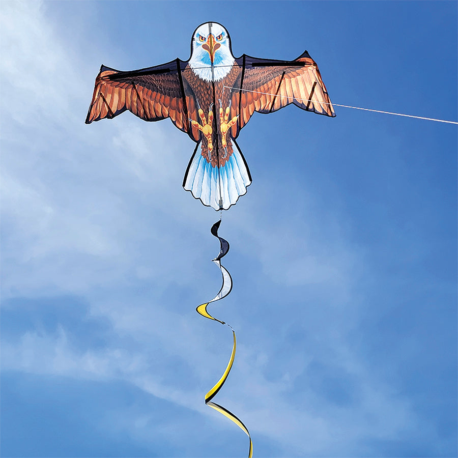 Flapping Bird Kite - Bald Eagle with twister tails soaring in a blue sky, showcasing its impressive wing flapping action during flight.