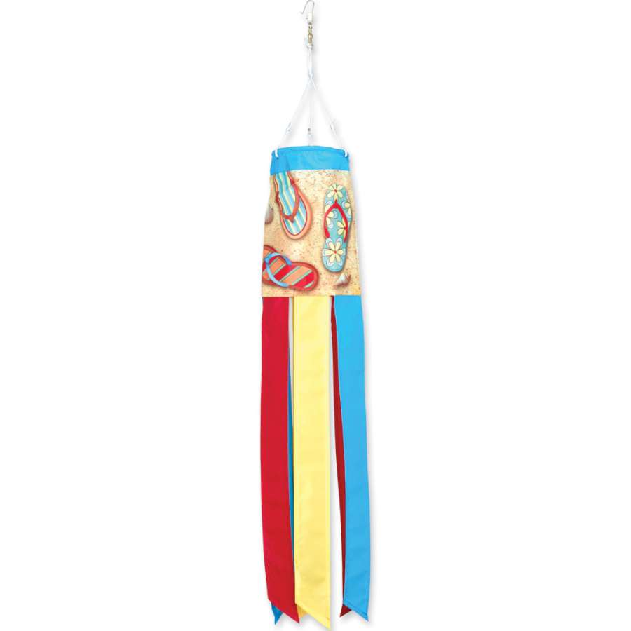 Colorful Flip Flops windsock, showcasing bright pink, blue, and yellow designs, displayed in a garden, swaying gently in the breeze.