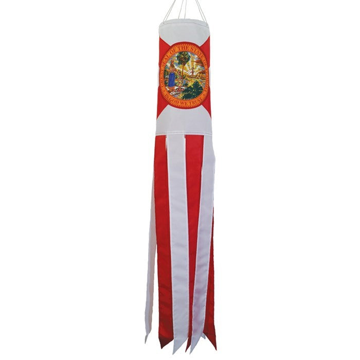 Florida 40-inch windsock displaying the state flag design with bright colors and iconic seal, fluttering outdoors in a scenic garden.