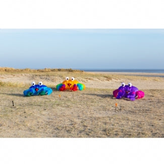 Compact blue and green bouncing crab kite accessory designed to hop and move in stronger breezes for playful beach and lawn displays.