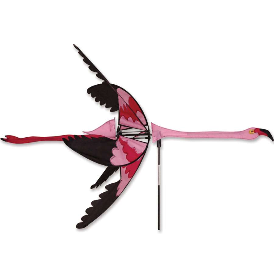 Vibrant Flying Flamingo Spinner in a garden setting, featuring bright colors and playful design that twirls in the wind.