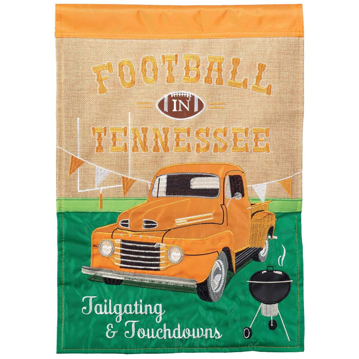 Football in TN Orange double-sided garden flag displaying intricate fabric applique and embroidery in an outdoor garden setting.