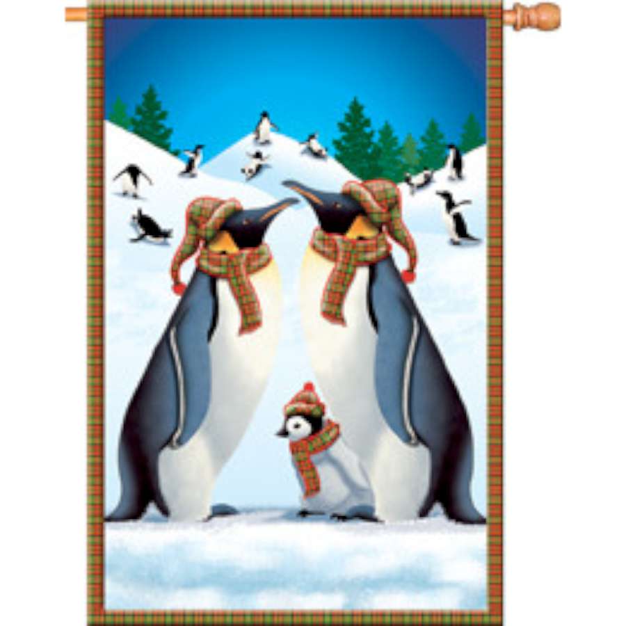 28 in. Frolic in Snow house flag displaying a whimsical winter design with snowflakes and snowmen in an outdoor setting.