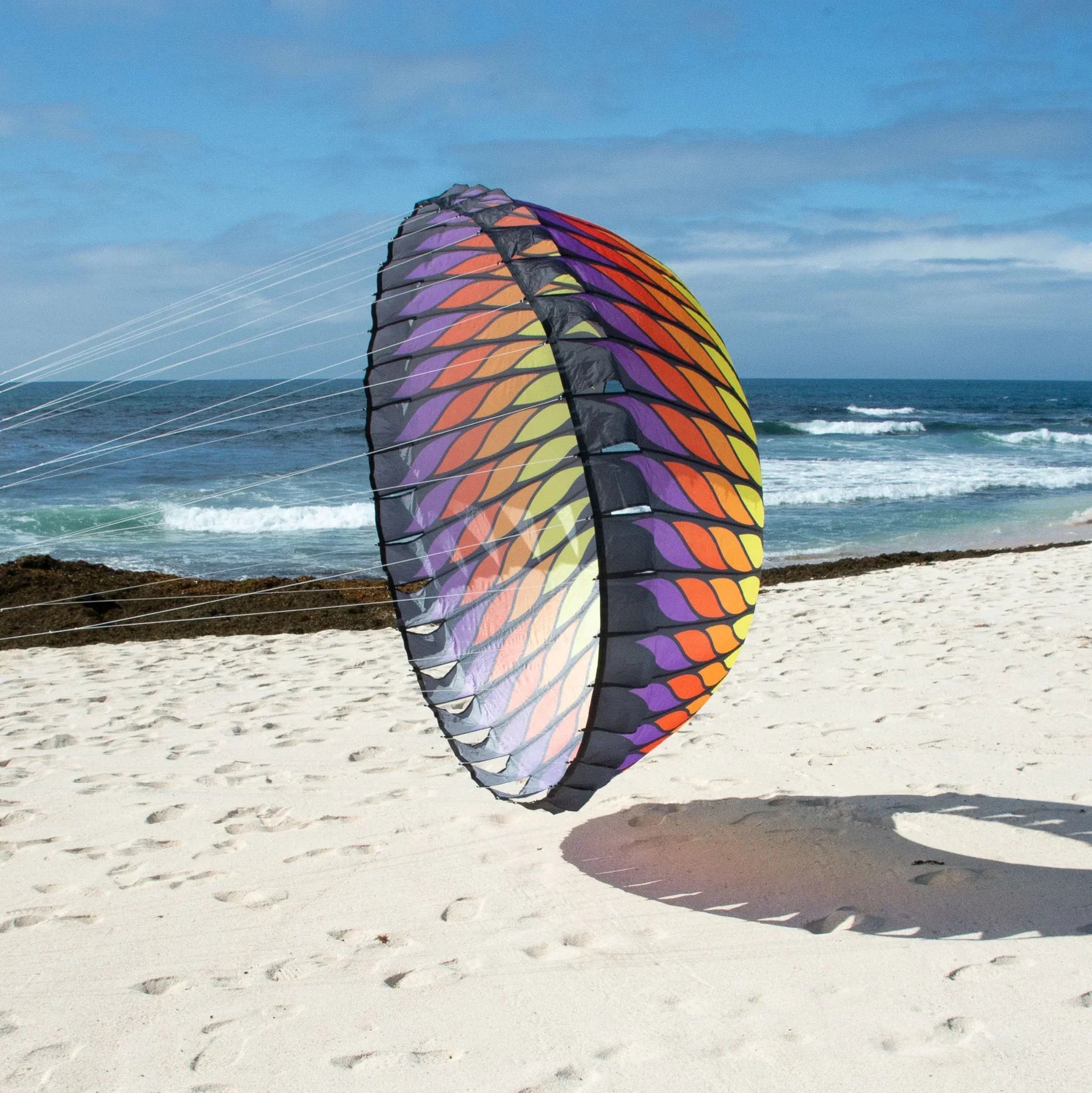 Red and orange 6.5-foot spinning bol inflates in wind to create bold swirling motion, ideal for beaches, festivals, or wind art displays.