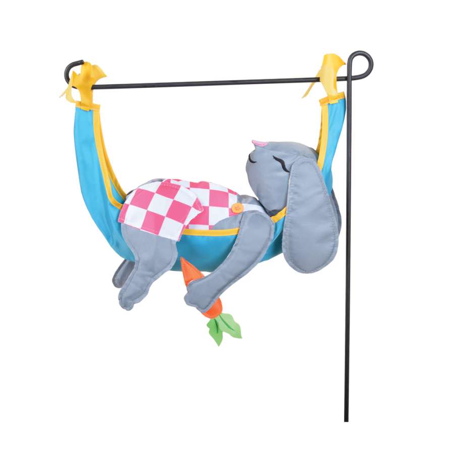 Garden Charm - Bunny garden accent featuring a playful bunny design, displayed outdoors in a vibrant garden setting.